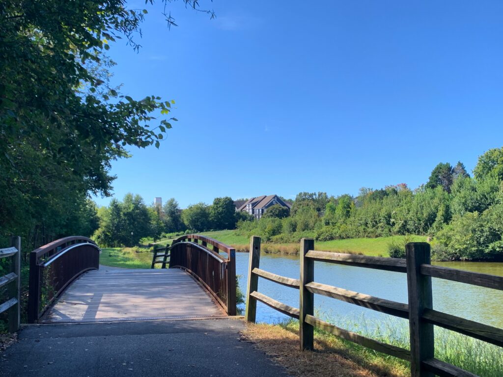 Arched bridge by a lake on the greenway in Huntersville, NC