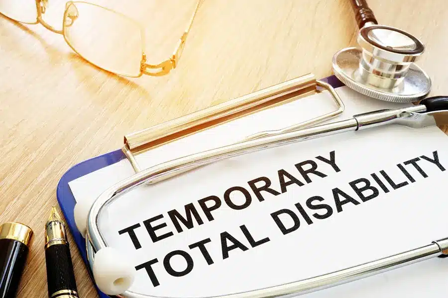 TTD Paperwork laid on a desk with glasses on the desk