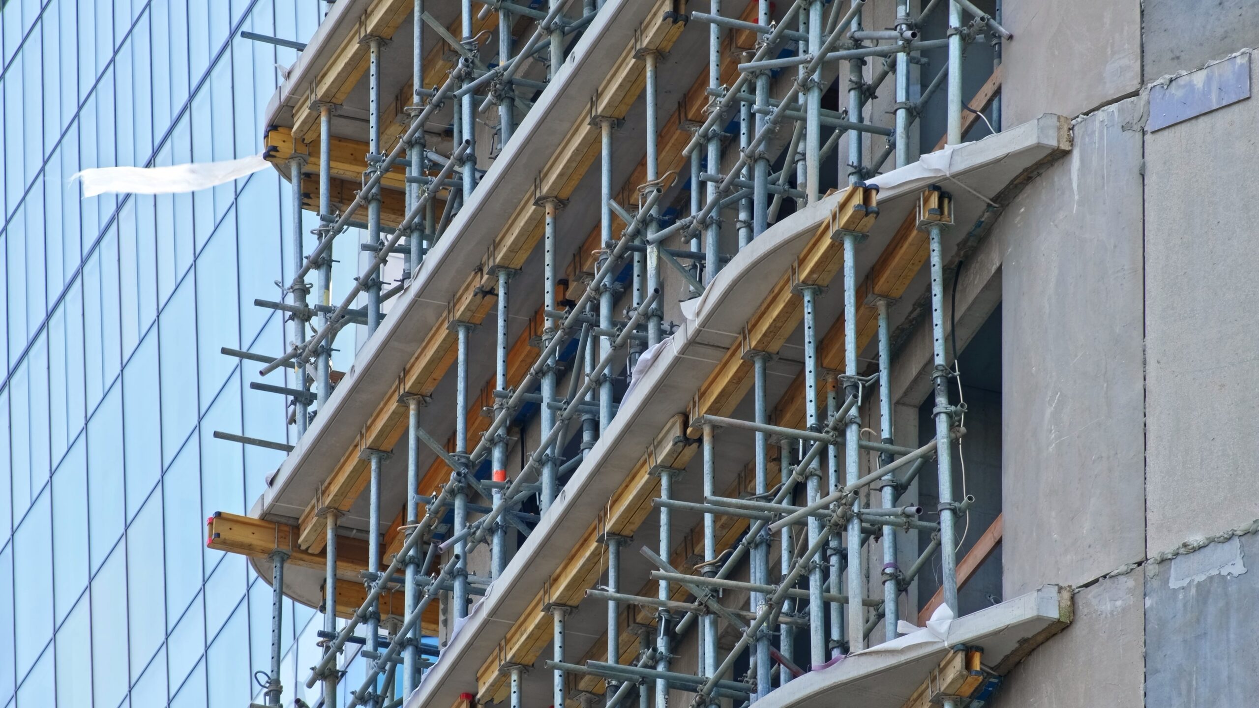 Unfinished,Multi,Storey,Residential,Building,Construction,Site,With,Metal,Scaffolding