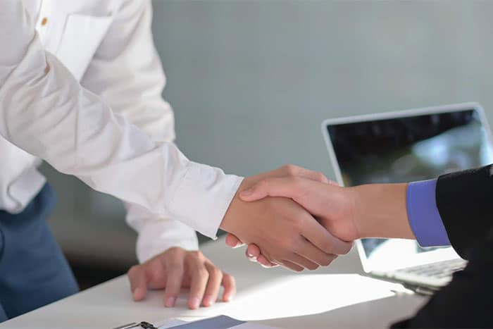 Doctor shaking hands with someone
