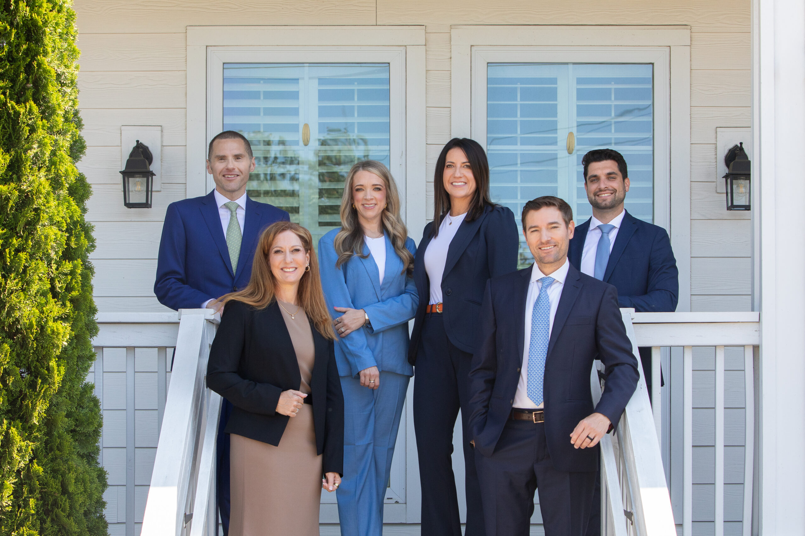Wilder Pantazis Law Group attorneys standing in front of their office