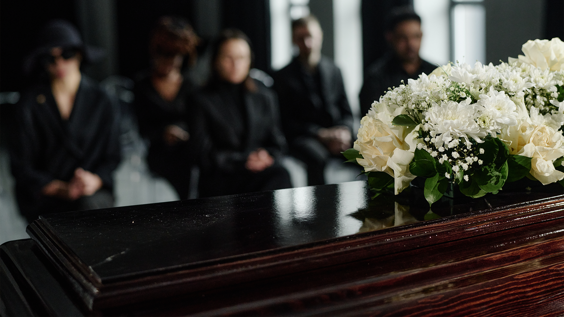 People attending funeral ceremony