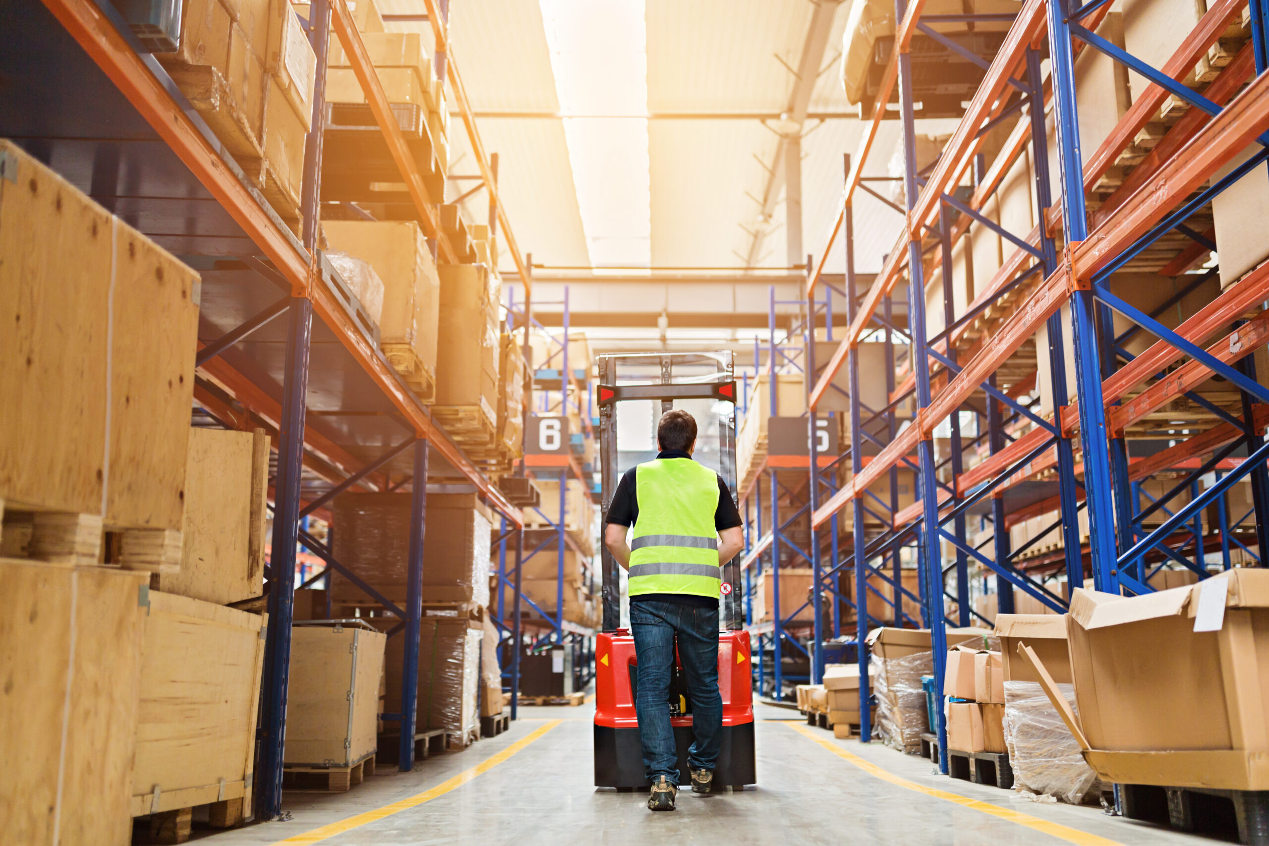 Storehouse,Employee,In,Uniform,Working,On,Forklift,In,Modern,Automatic