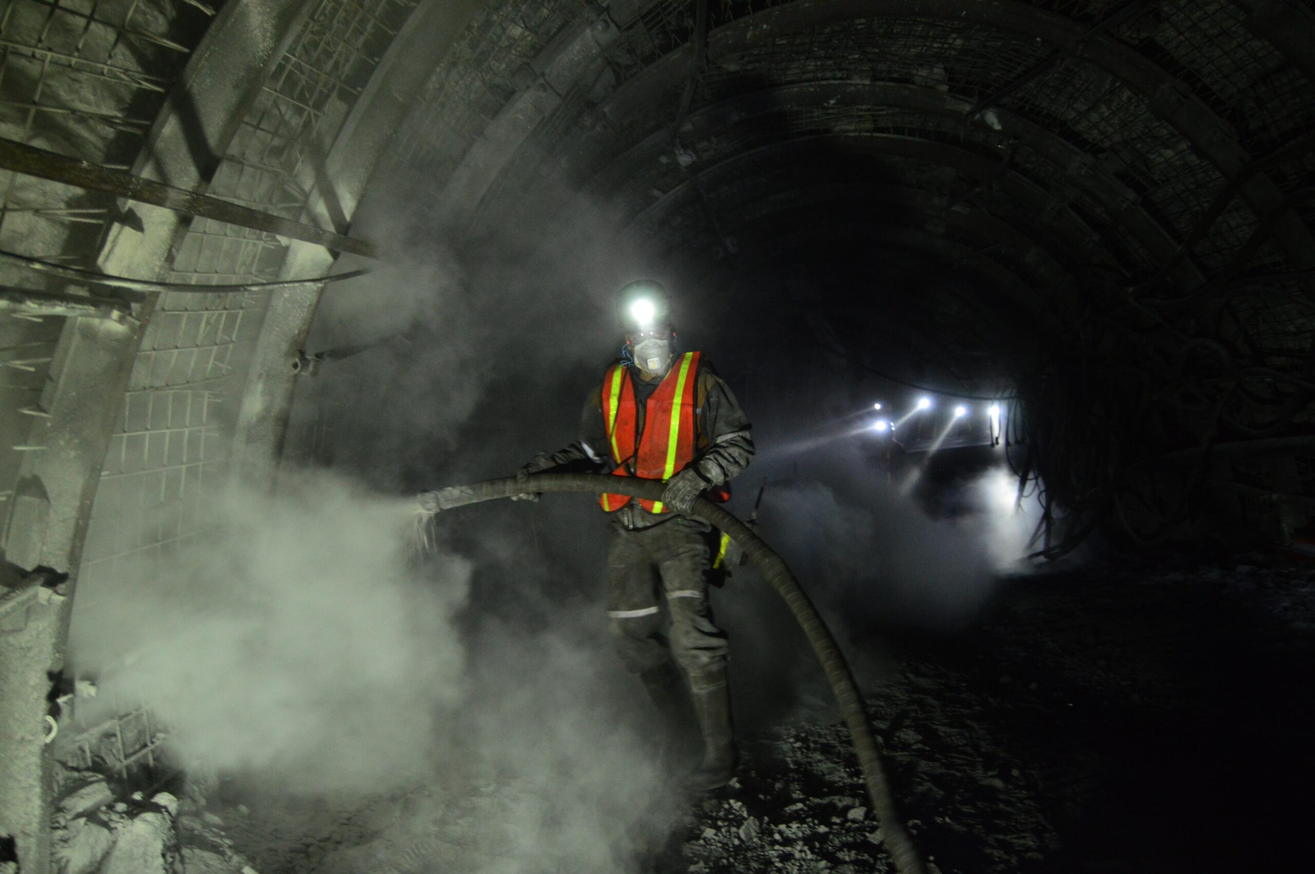 Miner,Spreading,Anti,Flame,Dust,Inside,A,Subterranean,Coal,Mine.