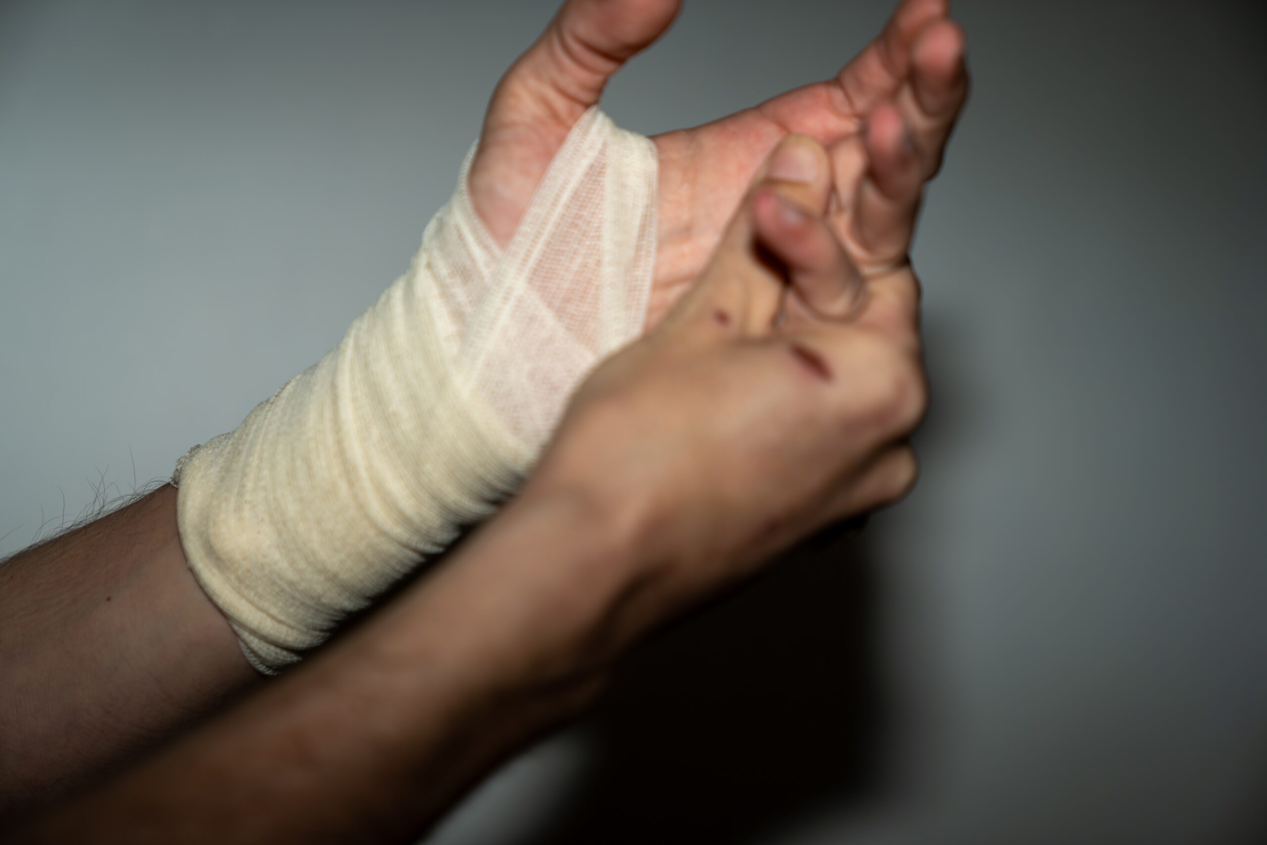 Male,Left,Hand,Injury,With,Bandage