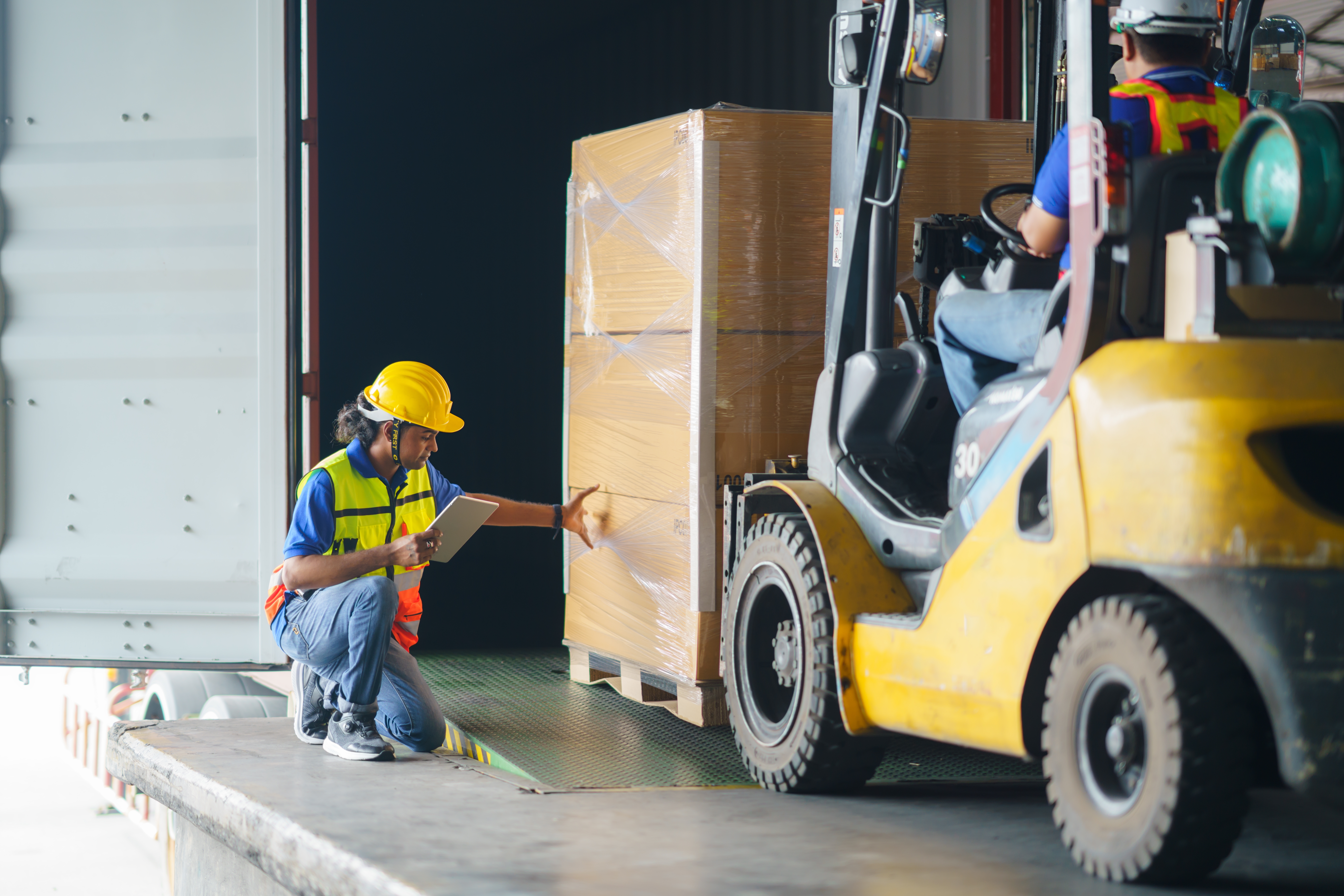 Asian,Forklift,Driver,Loading,A,Shipping,Cargo,Container,With,A
