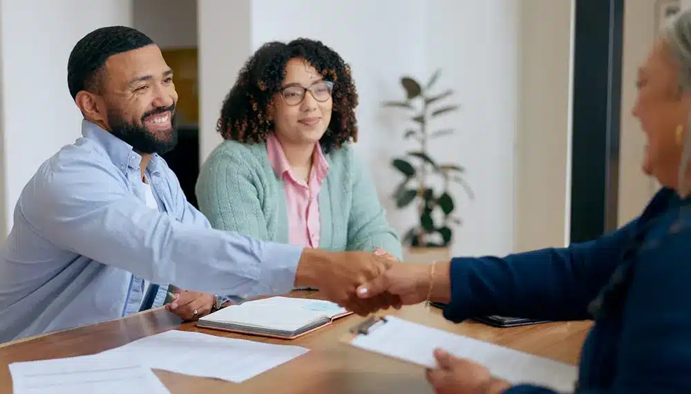 Man and woman speaking with a lawyer